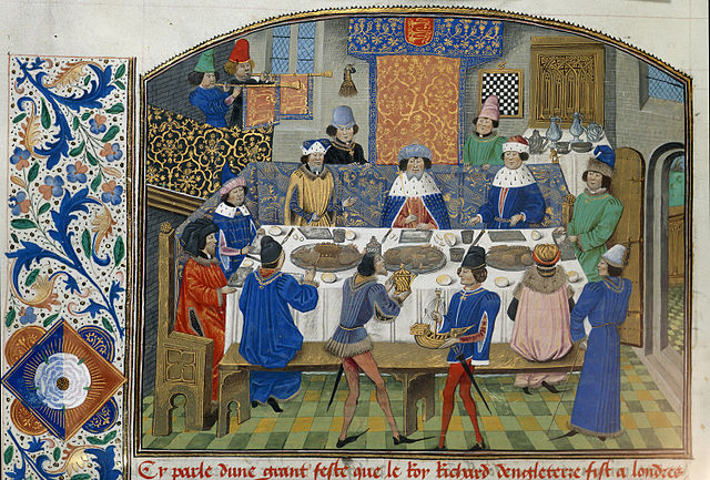 Manuscript illustration of Richard II dining with his dukes in a lavishly decorated dining room.