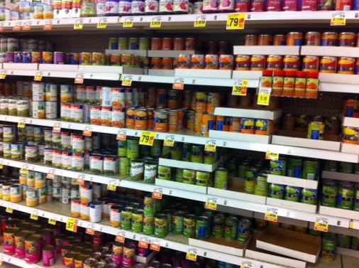 Canned vegetables on a shelf.