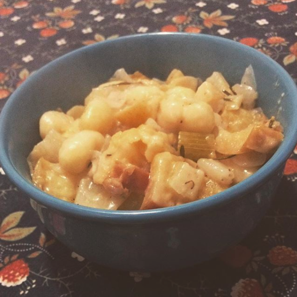 A bowl of gnocchi with apple, fennel, and parmesan.